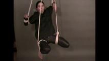 4 short videos in one of an beautiful black haired archive girl tied and gagged on the floor wearing sexy shiny nylon rainwear (Video)