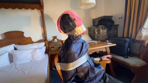 Rachel Adams bound, pantygagged and pantyhooded in shiny nylon Rainwear
