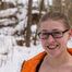 Katrin barefoot in the snow.
