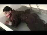 Watch Maggy beeing bound and gagged in a bathtube wearing a shiny nylon Skisuit from our Archives 2012