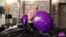 470 Chrissy pops 3 of her logo balloons