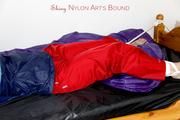 Jill tied and gagged in shiny nylon rainware