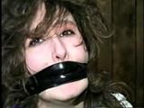 ERICA IS MOUTH STUFFED, WRAP TAPE GAGGED & BALL-TIED (D29-8)