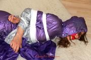 Alina tied, hodded and gagged on the floor in an purple/silver shiny PVC suit (Pics)