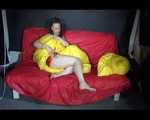 Sexy Mara wearing only a red shiny nylon shorts lolling and posing on the sofa (Video)