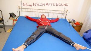 A nice cuty hooded, tied and gagged on bed