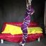 Watching sexy Sonja wearing a supersexy purple shiny nylon rainwear combination being tied and gagged overhead with ropes and a clothgag (Video)