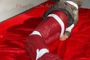 ***NEW MODEL*** Sandra wearing highheels and a sexy red crazy sensation skibib as well as a grey down jacket tied and gagged on a sofa with tape (Pics)