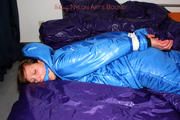 Alina tied and gagged in a shiny skisuit
