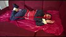 Lucy tied, gagged and hooded on a sofa wearing an oldschool rainwear combination (Video)