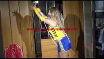***NEW MODEL*** Sandra wearing highheels and a sexy blue/yellow shiny nylon shorts and a yellow top tied and gagged with ropes (Video)