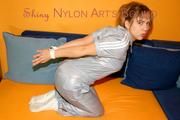 Beautiful archive girl tied and gagged wearing a shiny grey nylon jumpsuit(Pics)