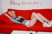 Jenny and Yvonne having a good time together wearing shiny nylon shorts and tops (Pics)