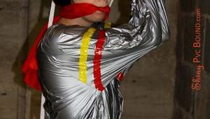 Nicole in an silver shiny PVC sauna suit tied and gagged in an cellar (Pics)