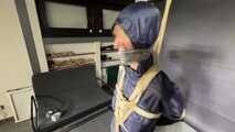 Myxxxy bound and gagged in a shiny nylon Rainsuit