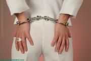 Gina in handcuffs