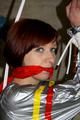 Nicole in an silver shiny PVC sauna suit tied and gagged in an cellar (Pics)