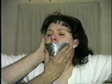 BALL-GAGGED, & TIED BETWEEN  2 PILLARS DAMSEL (D16-12)