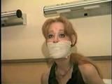 . 41 Yr OLD RED HEADED FAMOUS FASHION MODEL IS OTM GAGGED, BAREFOOT, TOE-TIED, HOPS AROUND ROOM, TIES, GAGS AND HANDCUFFS HERSELF WHILE WEARING BLUE JEANS  PT 8  (D60-5)