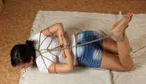 Ballgagged barefoot Lois, hogtied with japanese combat tying system, wiggles on the floor