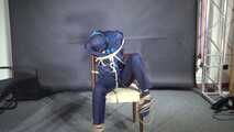Marie bound and gagged in shiny nylon Rainwear