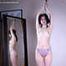 Tracy: topless barefoot girl with noose on her neck, having her to stand on her tip toes to breathe, is tickled by camera man