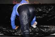 Sexy Sandra wearing a supersexy black shiny nylon rain pants and a sexy shiny blue rain jacket lolling on the sofa (Pics)