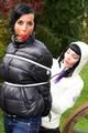 Jill ties her friend in shiny downjackets