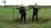 Jasmin & Larissa tied on fence Photoshoot