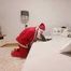 Putting Santa Claus over his knee