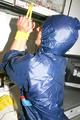 Stella tied, gagged and hooded in the kitchen wearing supersexy blue rainwear (Pics)