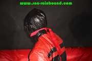 Sexy PIA wearing a sexy blue rainbib and a black/red shiny nylon rainjacket being tied, gagged and hooded on a chair with ropes and a ballgag (Pics)