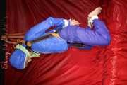 Sexy Sonja being tied and gagged with ropes and a clothgag hanging wearing a sexy rainwear combination (Pics)