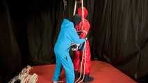 Sebastien breathplay in a red PVC jumpsuit.