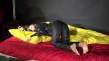 Sexy Sandra wearing sexy shiny nylon rainwear lolling in bed of nylon (Pics)
