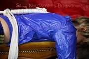 Watching sexy Sonja wearing a sexy shiny nylon shorts in blue and a blue rain jacket being tied and gagged on a stool with ropes and a clothgag (Pics)