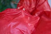 Lucy wearing a sexy shiny nylon shorts and two rain jackets feeling breath control (Pics)
