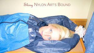 Archive girl tied and gagged with tape and rope wearing shiny nylon rainwear in blue (Pics)