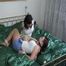 Two of our beautiful archive girls in white and light blue shiny nylon shorts tied and gagged in a bed (Video)