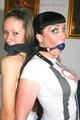 Jill and Petra tied and gagged to eachother in a living room both wearing sexy shiny nylon shorts and a top (Pics)