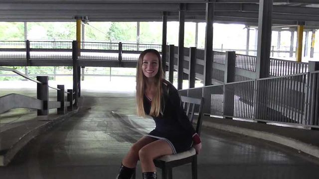 Stella on chair at car park 1/2