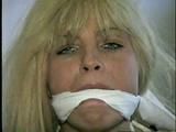 BLONDE BOMBSHELL TRACY IS SPONGE STUFFED AND CLEAVE GAGGED (D36-8)