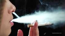 A young lady showing her smoking skills in a closeup video 