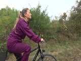 Get a Video with Sandra riding her bike enjoying her shiny nylon Rainwear