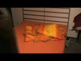 Being at home with Alina wearing shiny nylon rainwear (Video)