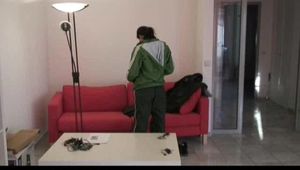 Enni dresses herself in shiny nylon shorts and rain cloths (Video)