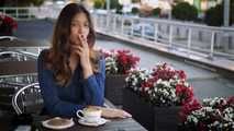 Gorgeous lady Irina having a cookie, coffee and a 120mm cigarette for lunch