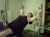 Sandra tied on a gym 1/2
