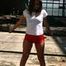 Stella posing outdoor wearing a supersexy red shiny nylon shorts and a white top (Pics)