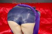 Mara wearing a sexy purple shiny nylon shorts (selfmade) and a rain jacket during preparing her sofa (Pics)